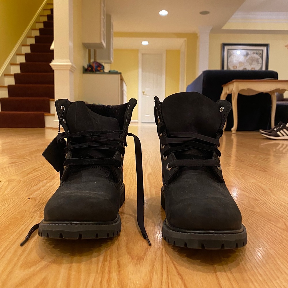 Black Timberlands with velvet details.
